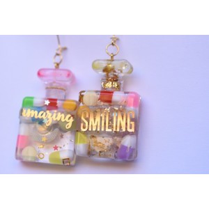 Perfume bottles earrings with pills inclusion