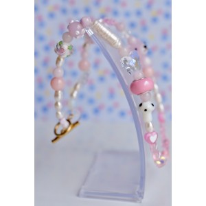 It's a girl pink necklace beaded with glass beads and water pearls