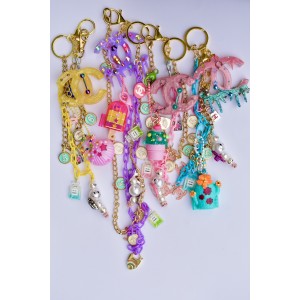 Chains and grigris fasteners and decorative charms for handbags