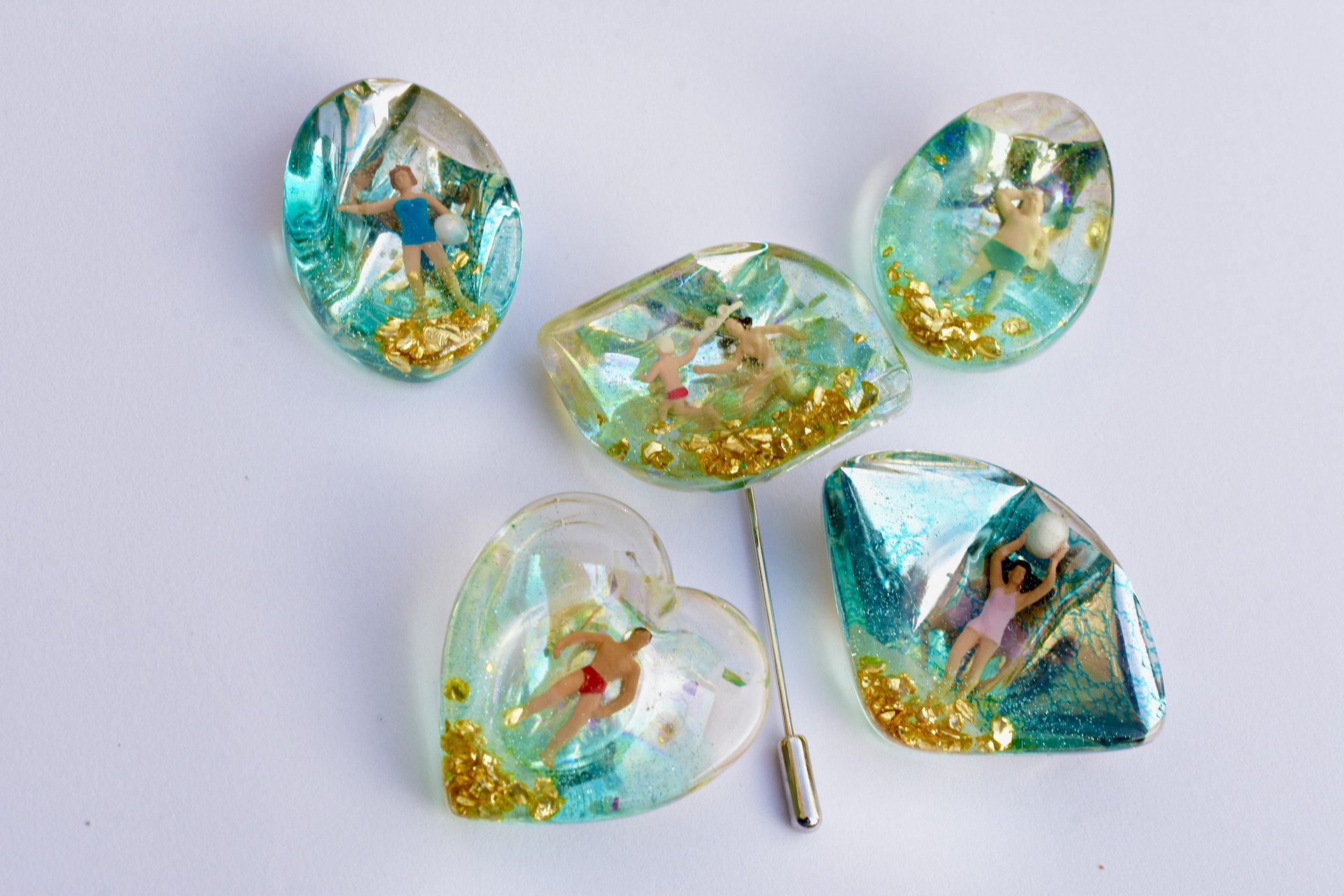 Resin brooch with tiny people at the beach