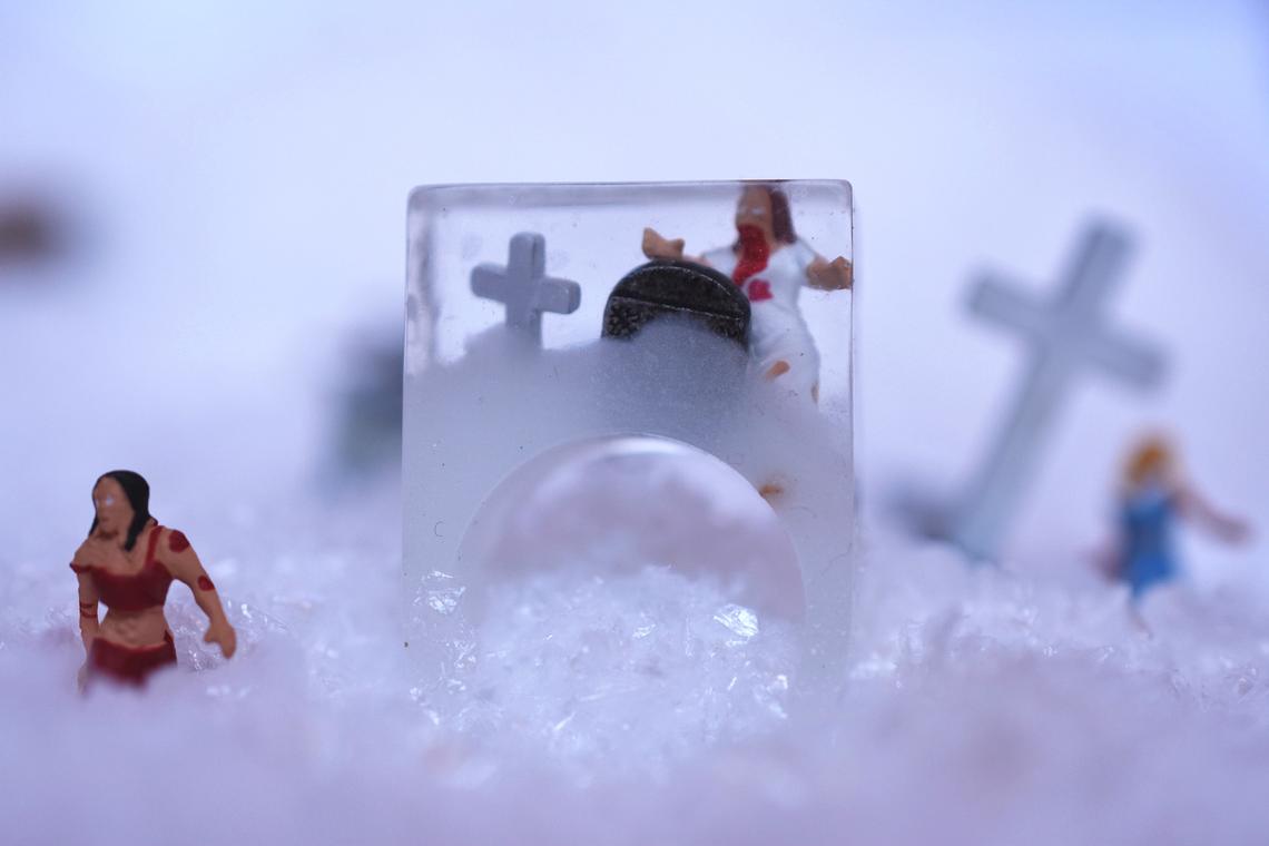 Resin ring with tiny people inside